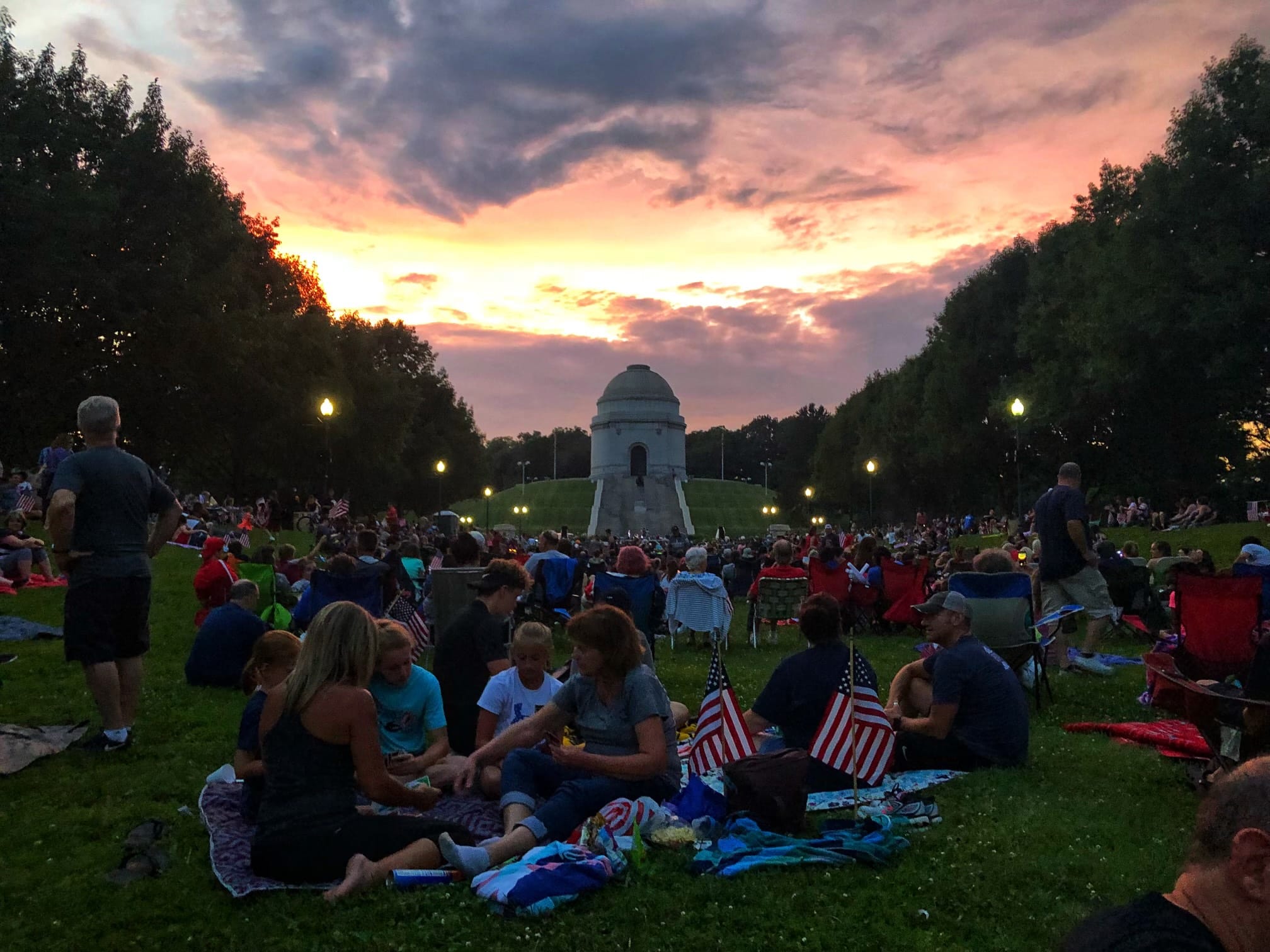 Iconic shot of the park in Canton Ohio at sunset with people picnicking in the grass
